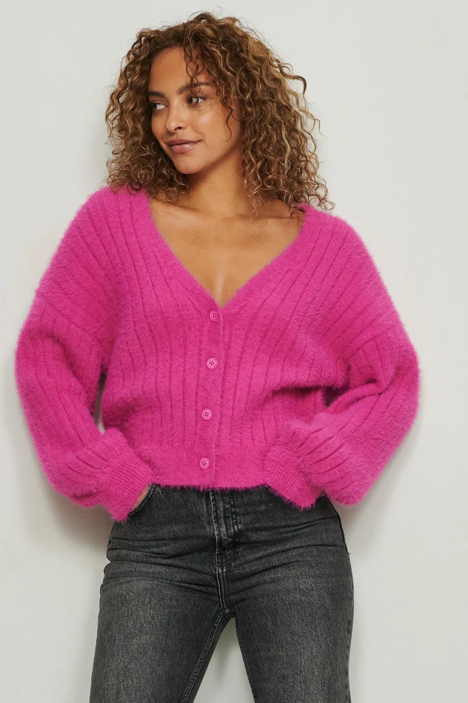 This chunky hot pink valentine's day sweater is both cozy and cut.e